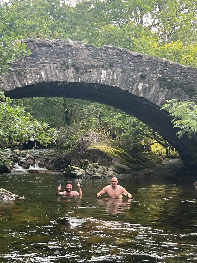 Solna walkers in a Lake District waterfall pool