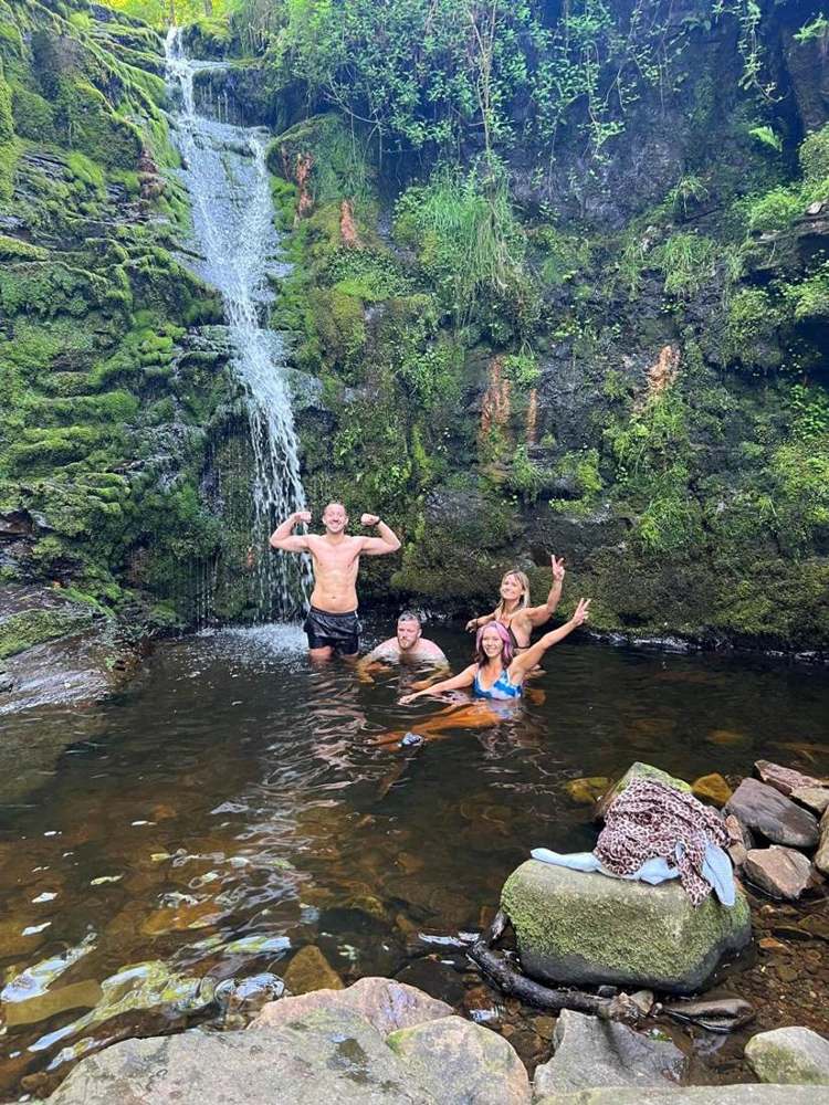Solna walkers in a Lake District waterfall pool