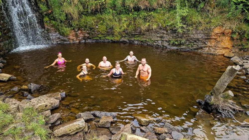 Solna walkers in a Lake District waterfall pool