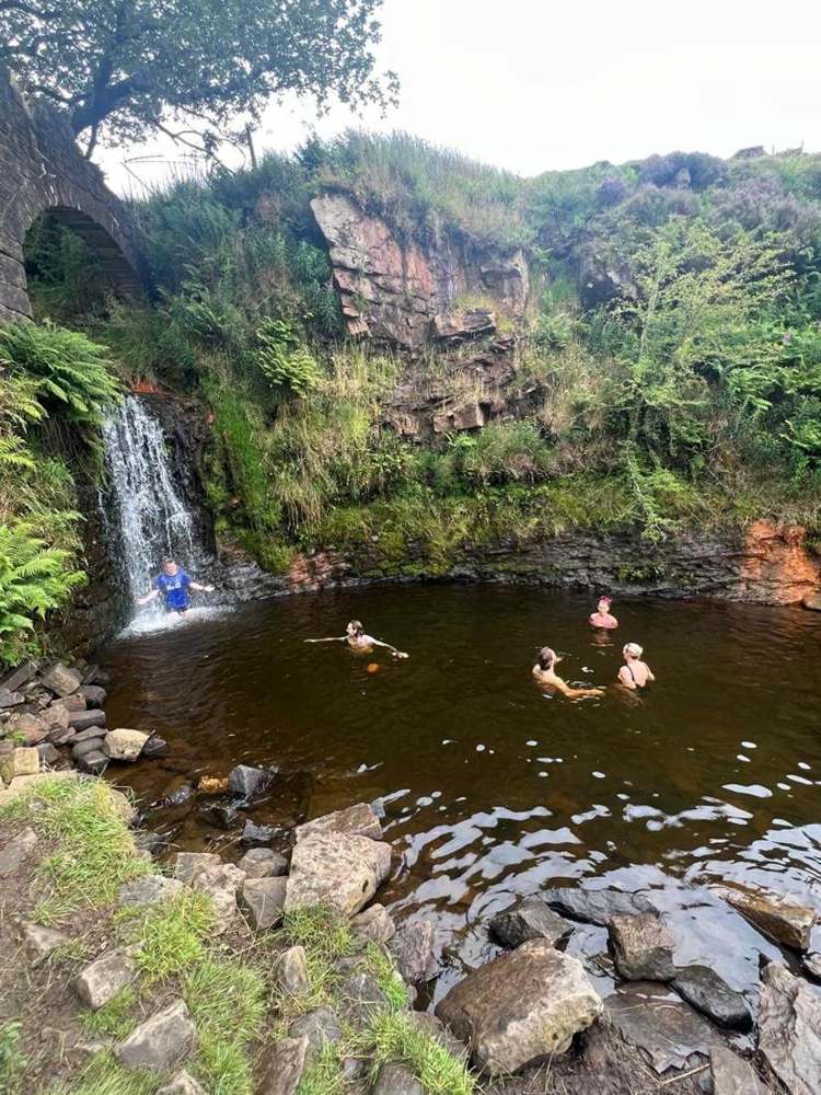Solna walkers in a Lake District waterfall pool