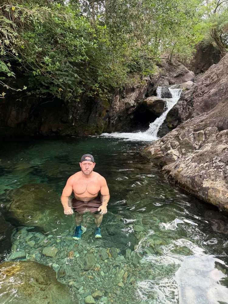 Solna walkers in a Lake District waterfall pool