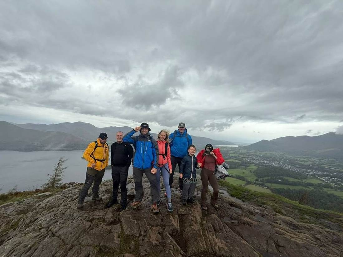 The Solna group on Walla Crag's rocky top with Derwent Water and the north-western fells behind